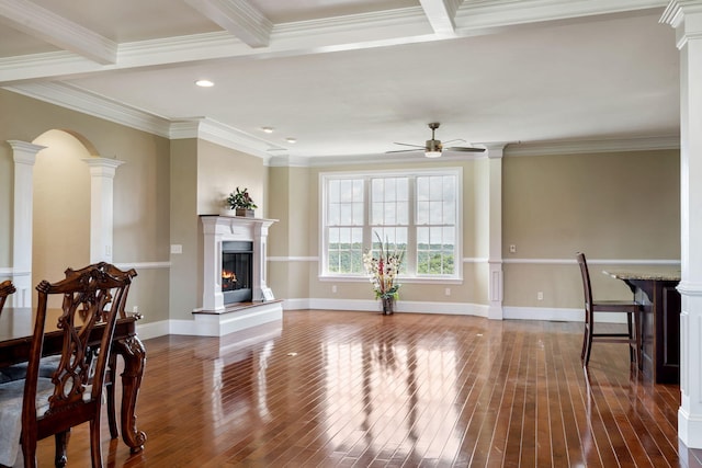 358 Spring View Pl, Reeds Spring, MO 65737 - living room with a ceiling fan, hardwood / wood-style flooring, a lit fireplace, ornamental molding, and arched walkways