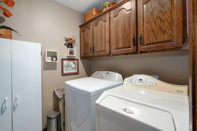 3141 E Raynell St Unit D, Springfield, MO 65804 - laundry room with cabinet space and washing machine and clothes dryer
