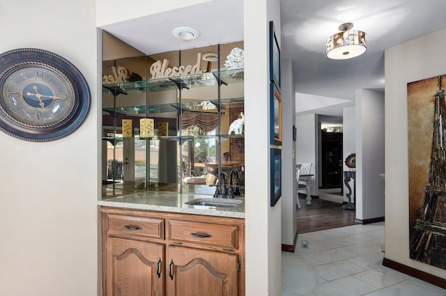 3141 E Raynell St Unit D, Springfield, MO 65804 - indoor wet bar with light marble finish flooring and baseboards