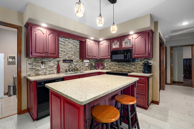 3141 E Raynell St Unit D, Springfield, MO 65804 - kitchen featuring black appliances, dark brown cabinets, tasteful backsplash, a center island, and recessed lighting