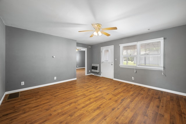 407 N Pine St, Pierce City, MO 65723 - unfurnished room with heating unit, ceiling fan, and wood finished floors