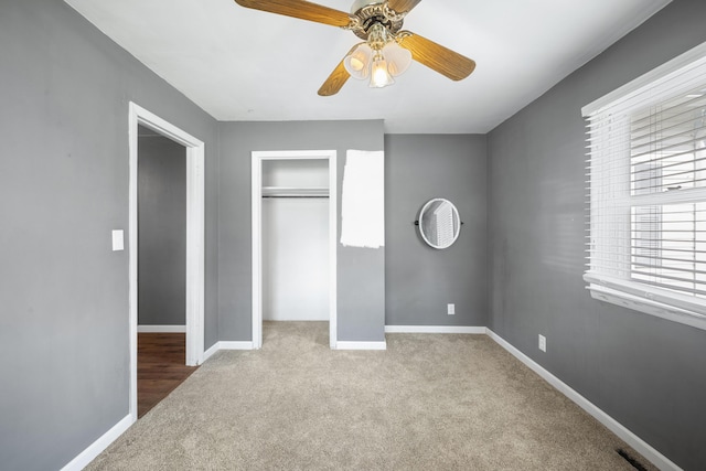 407 N Pine St, Pierce City, MO 65723 - unfurnished bedroom featuring carpet flooring, a closet, and a ceiling fan