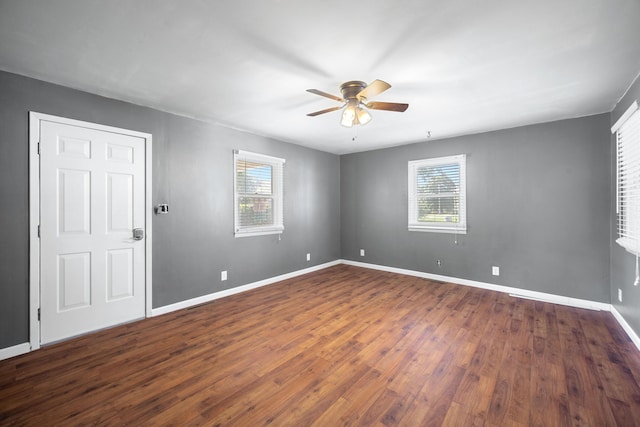 407 N Pine St, Pierce City, MO 65723 - spare room with ceiling fan, plenty of natural light, and dark wood-type flooring