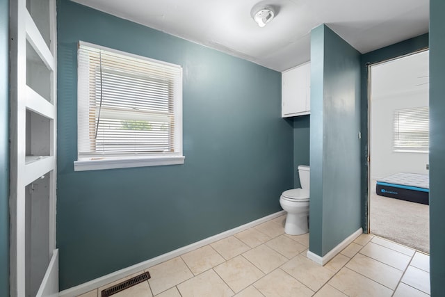 407 N Pine St, Pierce City, MO 65723 - bathroom featuring toilet and tile patterned floors
