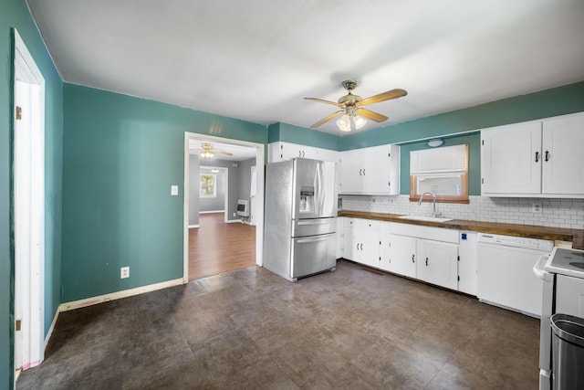407 N Pine St, Pierce City, MO 65723 - kitchen with stainless steel fridge with ice dispenser, white dishwasher, ceiling fan, and decorative backsplash