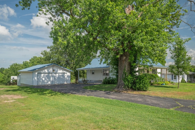 407 N Pine St, Pierce City, MO 65723 - view of grassy yard with a garage and an outbuilding