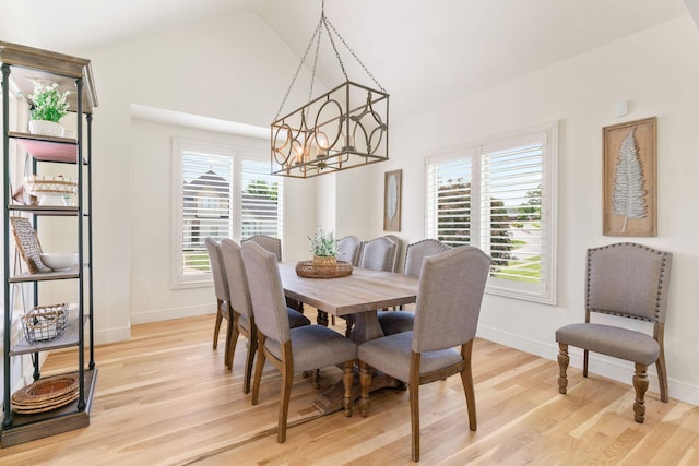 1303 E Eaglegate Pkwy, Springfield, MO 65804 - dining room featuring a chandelier, light wood-style floors, healthy amount of natural light, and high vaulted ceiling