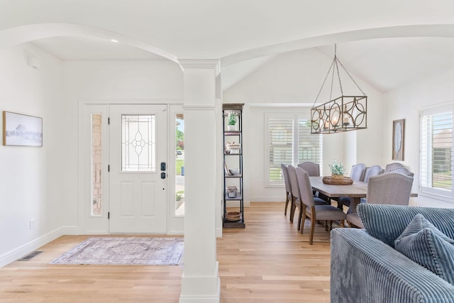 1303 E Eaglegate Pkwy, Springfield, MO 65804 - entrance foyer with a chandelier, light wood-style flooring, arched walkways, and vaulted ceiling