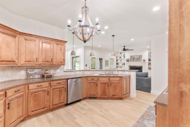 1303 E Eaglegate Pkwy, Springfield, MO 65804 - kitchen featuring dishwasher, open floor plan, light wood-style flooring, light stone counters, and a chandelier