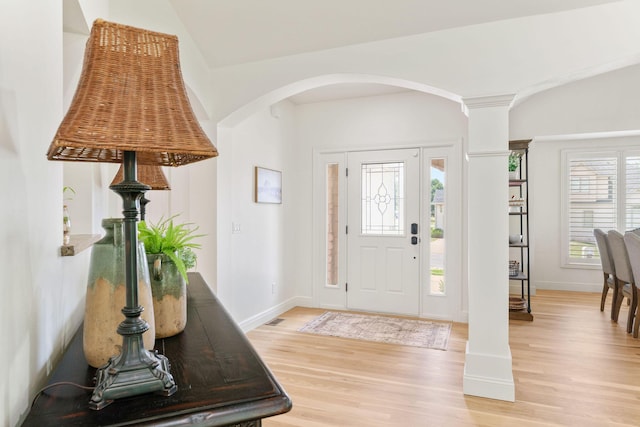 1303 E Eaglegate Pkwy, Springfield, MO 65804 - entrance foyer featuring light wood-type flooring, arched walkways, and ornate columns