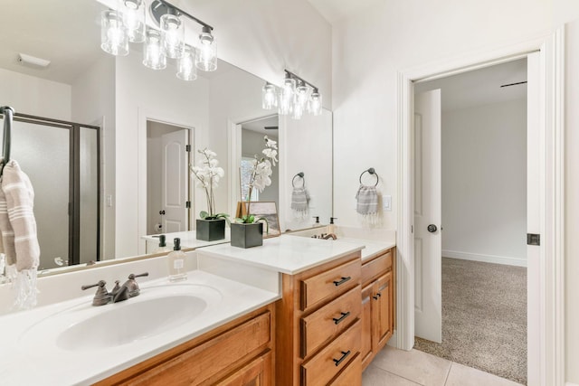 1303 E Eaglegate Pkwy, Springfield, MO 65804 - bathroom with vanity, tile patterned flooring, and a stall shower