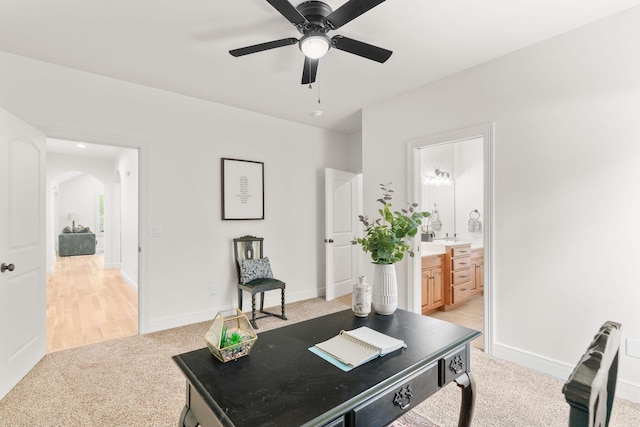 1303 E Eaglegate Pkwy, Springfield, MO 65804 - office featuring light carpet, arched walkways, and ceiling fan