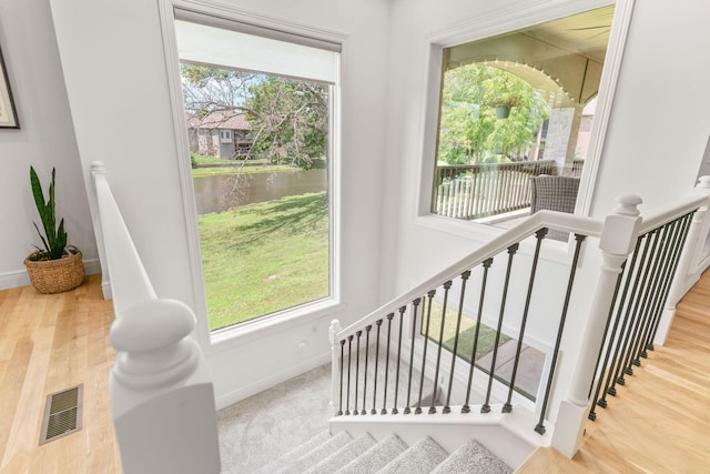 1303 E Eaglegate Pkwy, Springfield, MO 65804 - stairway with a water view and wood finished floors