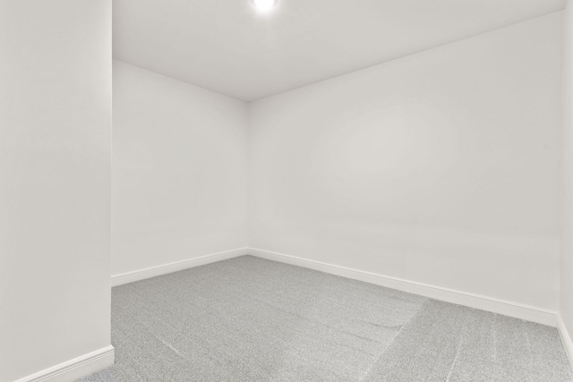 1303 E Eaglegate Pkwy, Springfield, MO 65804 - empty room with carpet floors and baseboards