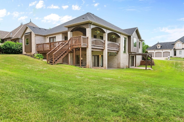1303 E Eaglegate Pkwy, Springfield, MO 65804 - back of property with brick siding, a yard, a wooden deck, and stairway