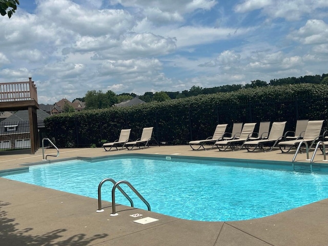 1303 E Eaglegate Pkwy, Springfield, MO 65804 - community pool featuring a patio area