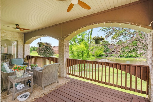 1303 E Eaglegate Pkwy, Springfield, MO 65804 - wooden terrace with ceiling fan, a water view, a lawn, and outdoor lounge area