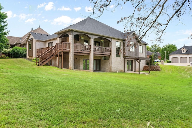 1303 E Eaglegate Pkwy, Springfield, MO 65804 - back of house featuring a yard, brick siding, a wooden deck, and stairs