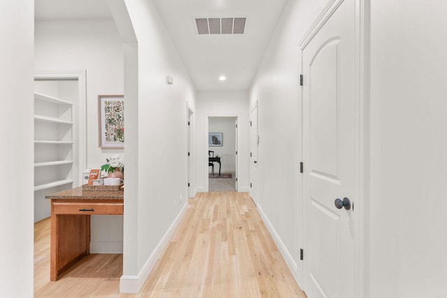 1303 E Eaglegate Pkwy, Springfield, MO 65804 - corridor featuring arched walkways, light wood-type flooring, and recessed lighting