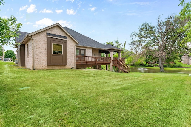 1303 E Eaglegate Pkwy, Springfield, MO 65804 - rear view of house featuring a deck with water view, stairway, and a yard