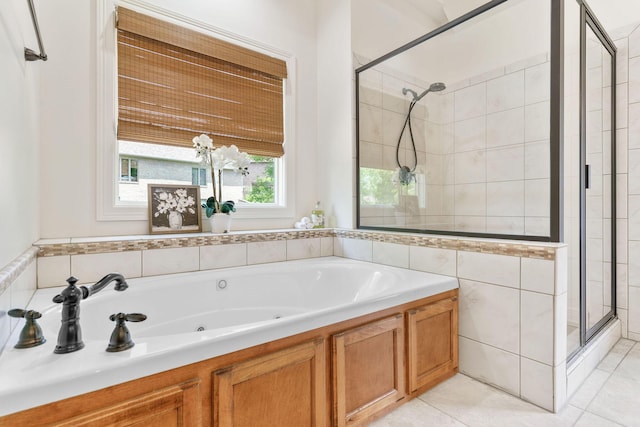 1303 E Eaglegate Pkwy, Springfield, MO 65804 - bathroom featuring a shower stall, a tub with jets, and tile patterned flooring