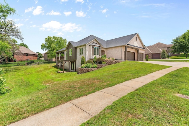 1303 E Eaglegate Pkwy, Springfield, MO 65804 - view of front of home featuring brick siding, driveway, and an attached garage