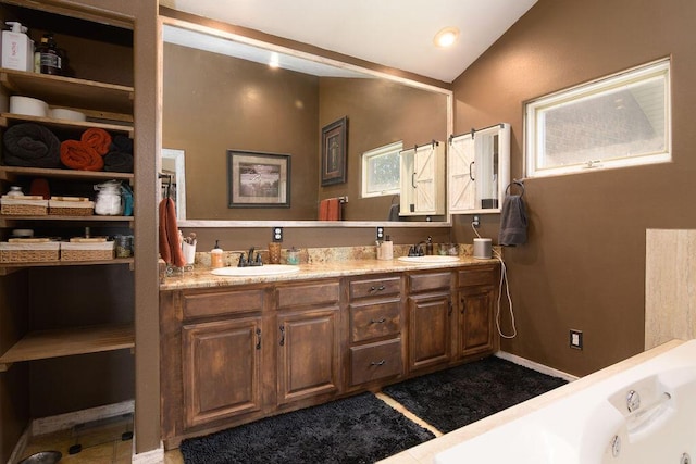 10626 W State Highway 76, Cape Fair, MO 65624 - bathroom featuring lofted ceiling, double vanity, and a tub with jets