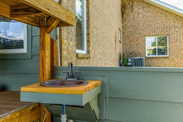 10626 W State Highway 76, Cape Fair, MO 65624 - bathroom featuring a sink and brick wall