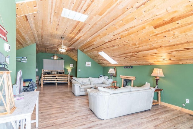 10626 W State Highway 76, Cape Fair, MO 65624 - living room with a skylight, wood finished floors, vaulted ceiling, and ceiling fan