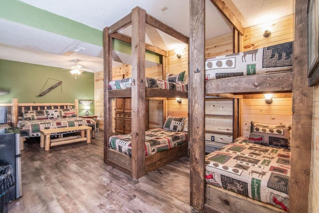 10626 W State Highway 76, Cape Fair, MO 65624 - bedroom with wood walls and wood finished floors