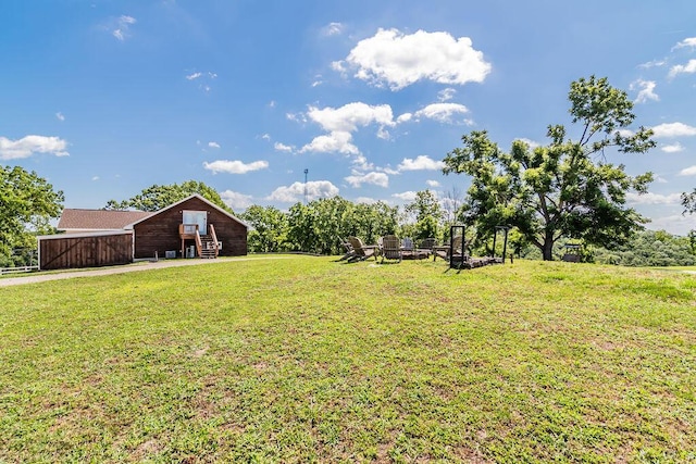 10626 W State Highway 76, Cape Fair, MO 65624 - view of grassy yard with an outdoor fire pit