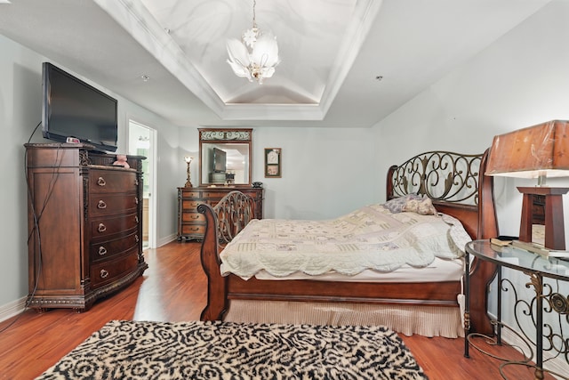 180 Grace Chapel Rd Unit 325, Blue Eye, MO 65611 - bedroom with a chandelier, a raised ceiling, wood finished floors, and lofted ceiling