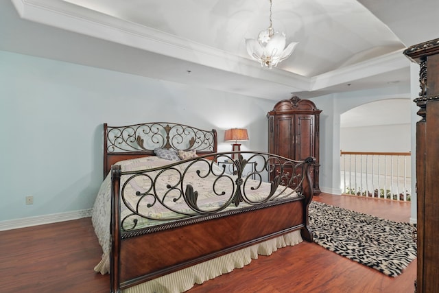 180 Grace Chapel Rd Unit 325, Blue Eye, MO 65611 - bedroom with a chandelier, wood finished floors, arched walkways, a tray ceiling, and ornamental molding