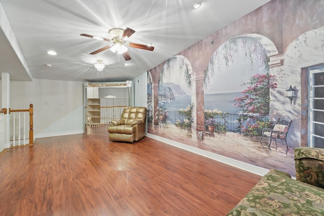 180 Grace Chapel Rd Unit 325, Blue Eye, MO 65611 - sitting room with wood finished floors, a ceiling fan, recessed lighting, and an upstairs landing