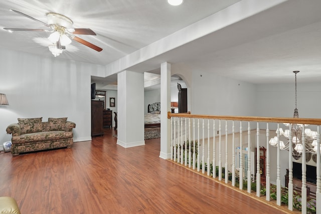180 Grace Chapel Rd Unit 325, Blue Eye, MO 65611 - living area with a ceiling fan, wood finished floors, arched walkways, and a chandelier