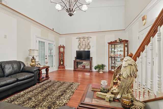 180 Grace Chapel Rd Unit 325, Blue Eye, MO 65611 - living room with a towering ceiling, a chandelier, wood finished floors, and stairway