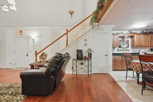 180 Grace Chapel Rd Unit 325, Blue Eye, MO 65611 - living room with stairway and light wood-style flooring