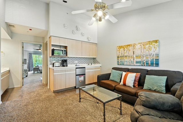 530 Spring Creek Ct Unit 5-10, Branson, MO 65616 - living room featuring ceiling fan, light tile patterned floors, and a high ceiling
