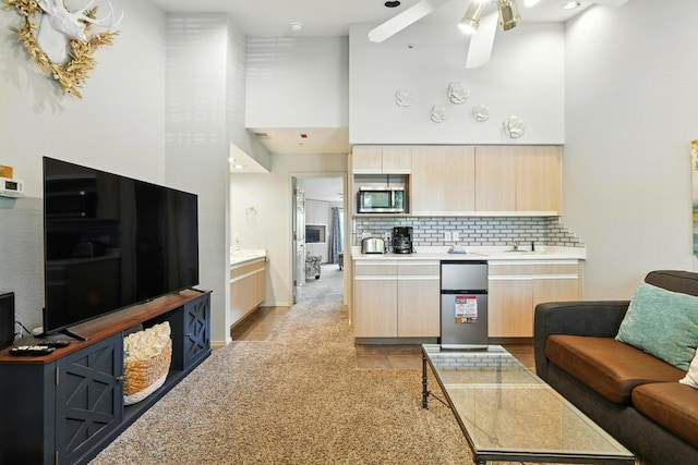 530 Spring Creek Ct Unit 5-10, Branson, MO 65616 - kitchen featuring stainless steel appliances, light brown cabinetry, a towering ceiling, modern cabinets, and ceiling fan