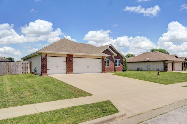 4531 W Somerset Dr, Battlefield, MO 65619 - view of front facade with brick siding, an attached garage, concrete driveway, and a shingled roof
