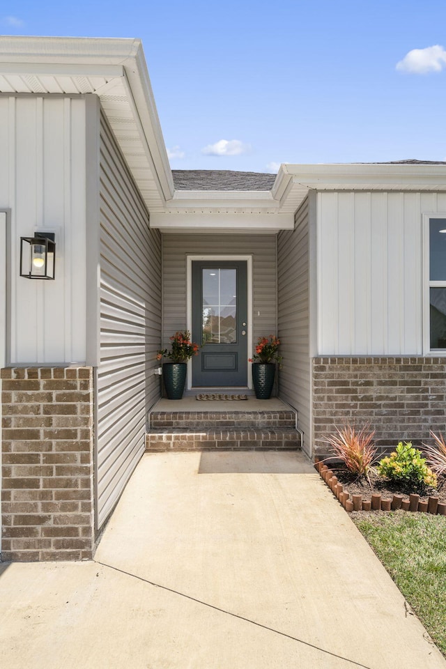 202 N Cheyenne Valley Rd, Nixa, MO 65714 - entrance to property featuring brick siding and board and batten siding