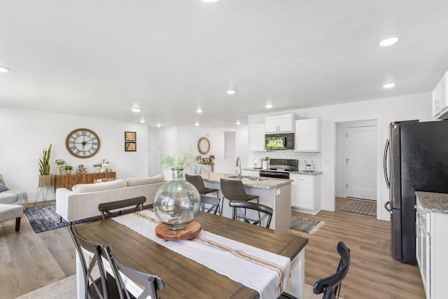 202 N Cheyenne Valley Rd, Nixa, MO 65714 - dining area with recessed lighting and light wood-type flooring