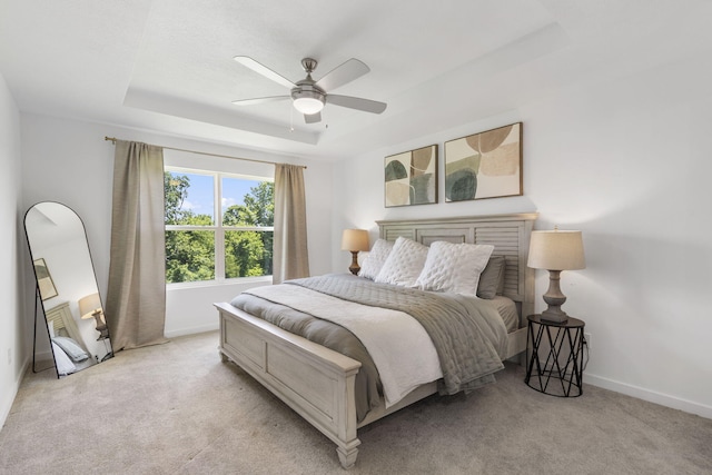 202 N Cheyenne Valley Rd, Nixa, MO 65714 - bedroom featuring a raised ceiling, light carpet, and ceiling fan