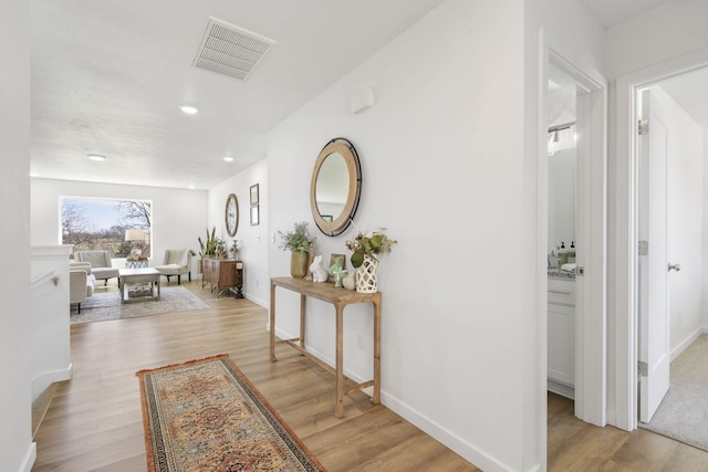 202 N Cheyenne Valley Rd, Nixa, MO 65714 - hallway featuring light wood-type flooring and recessed lighting