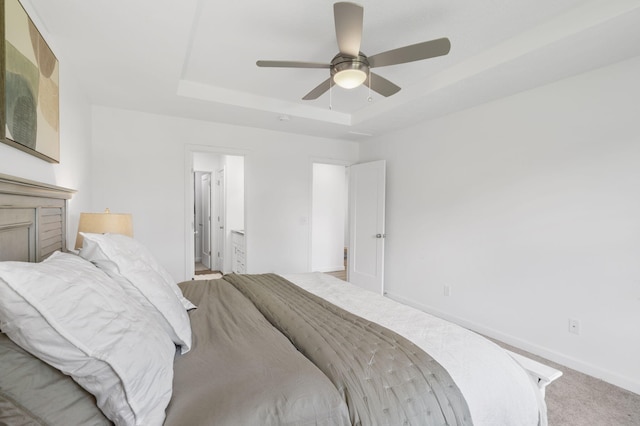 202 N Cheyenne Valley Rd, Nixa, MO 65714 - bedroom featuring a raised ceiling, carpet flooring, a ceiling fan, and ensuite bathroom