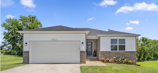 202 N Cheyenne Valley Rd, Nixa, MO 65714 - view of front of house with brick siding, concrete driveway, an attached garage, and a front lawn