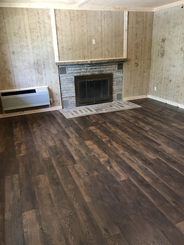 462 Campbell Point Rd, Shell Knob, MO 65747 - unfurnished living room with hardwood / wood-style floors, wood walls, a stone fireplace, and a wall mounted air conditioner