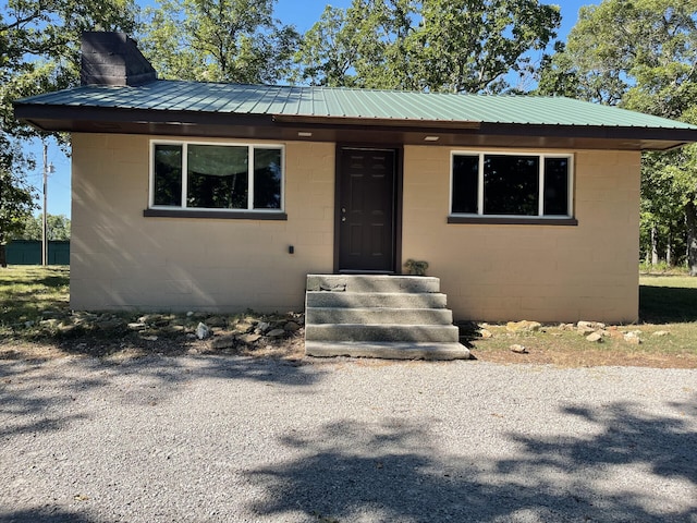 462 Campbell Point Rd, Shell Knob, MO 65747 - view of front facade with concrete block siding, a metal roof, and a chimney