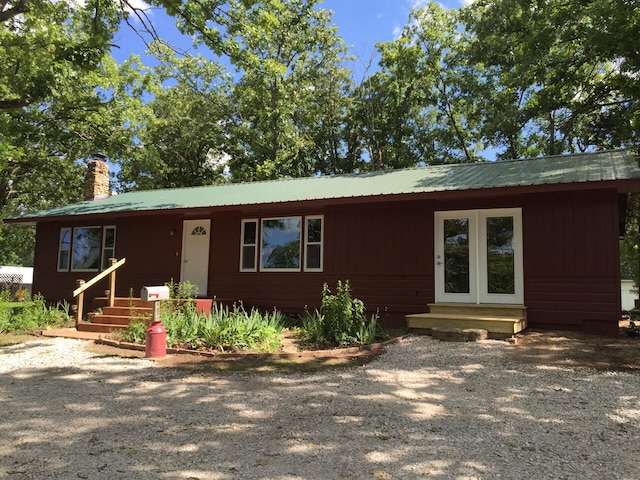 462 Campbell Point Rd, Shell Knob, MO 65747 - view of front facade featuring a chimney, a metal roof, and entry steps