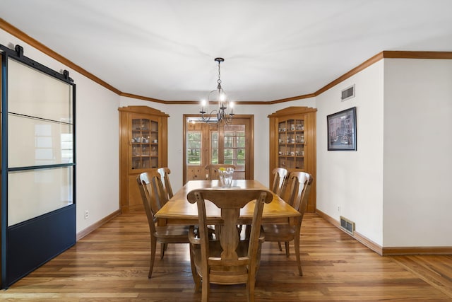 1471 E Bennett St, Springfield, MO 65804 - dining area with a chandelier, light wood finished floors, and ornamental molding